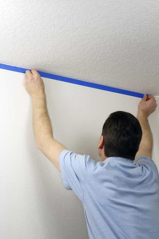 masking a wall with blue tape